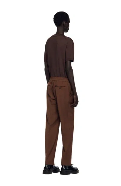 Sandro Elasticated Straight-leg Trousers In Brown