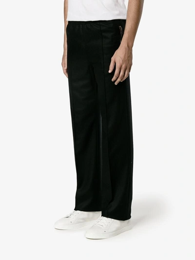 Shop Givenchy Raised Seam Trousers In Black