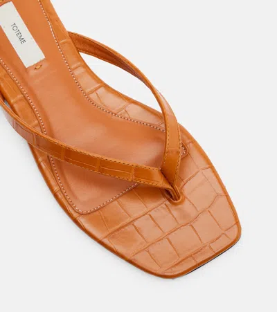 Totême Toteme Crocodile-effect Leather Flip Flops In Orange