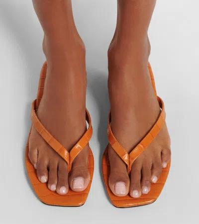 Totême Toteme Crocodile-effect Leather Flip Flops In Orange