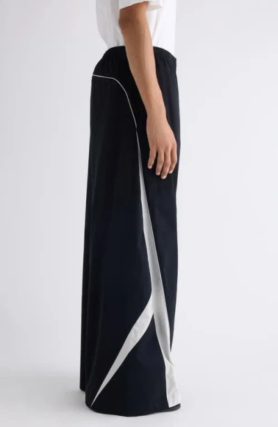 Acne Studios Color-blocked Piping Casual Pants In Black