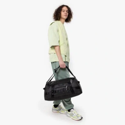 Eastpak Small Tarp Black2 Duffel Pack At Urban Outfitters