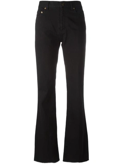 Shop Saint Laurent Flared Raw Edge Jeans In Black