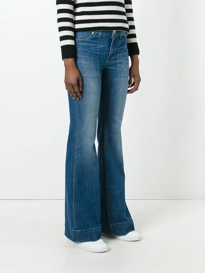 Shop Michael Michael Kors Flared Jeans In Blue