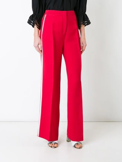 Shop Fendi Side Stripe Flared Trousers In Red
