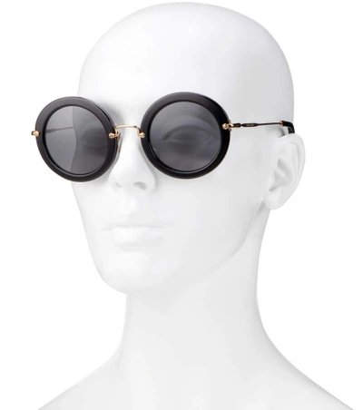 Shop Miu Miu Round Sunglasses