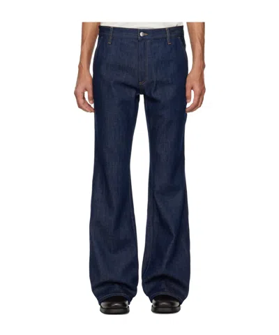 Amiri Raw Boot Cut Jeans In Blue
