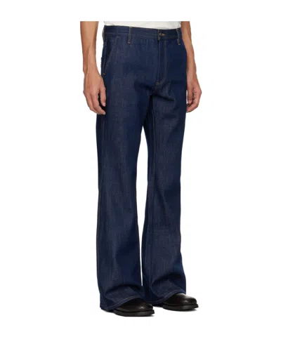 Amiri Raw Boot Cut Jeans In Blue