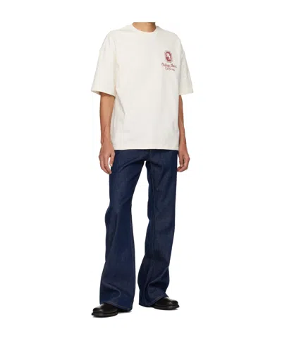 Amiri Raw Boot Cut Jeans In Blue