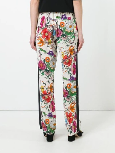 Shop Gucci Flora Snake Print Trousers In White