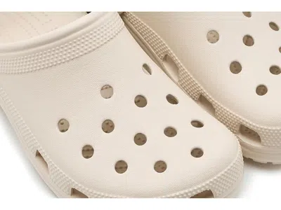 Crocs Solid Color Classic Clogs With Cut-out Details In Brown