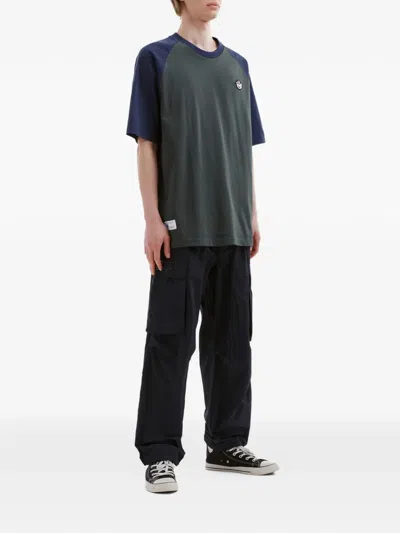 Chocoolate Cargo Label Trousers In Black