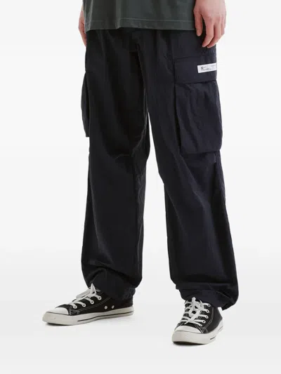 Chocoolate Cargo Label Trousers In Black