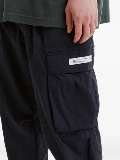 Chocoolate Cargo Label Trousers In Black