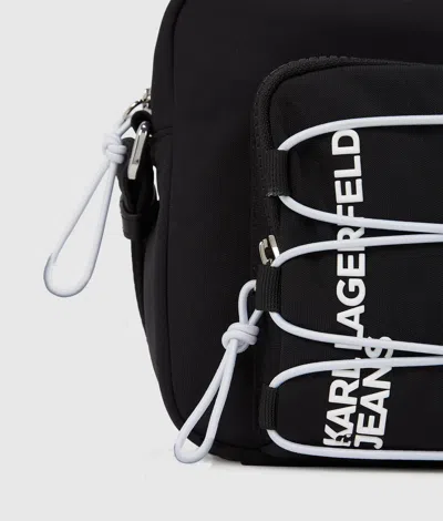 Kl Jeans Utility Drawstring Camera Bag In Black