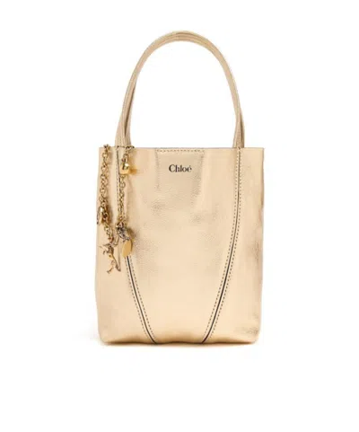 Chloé Spin Metallic Leather Top Handle Bag In Brown