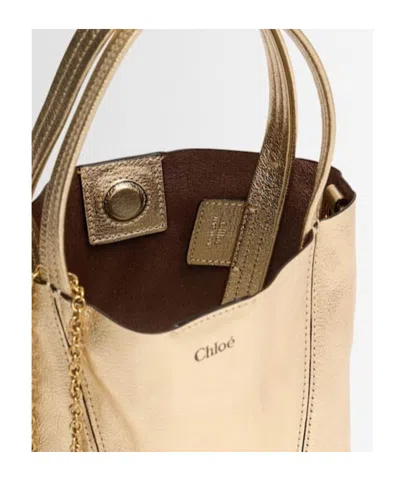 Chloé Spin Metallic Leather Top Handle Bag In Brown