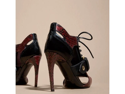 Shop Burberry Buckle Detail Leather And Snakeskin Cut-out Ankle Boots In Bordeaux