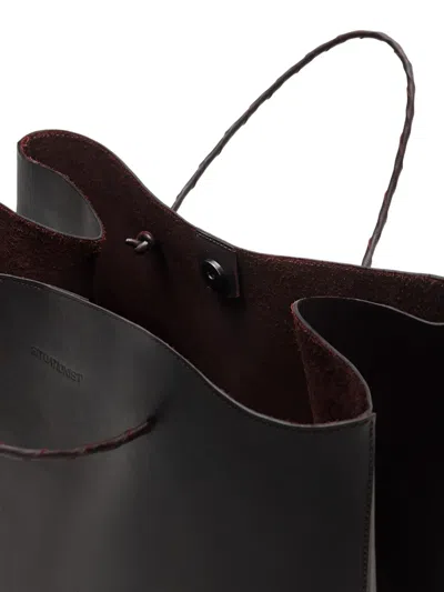 Situationist Braided-handle Tote Bag In Black