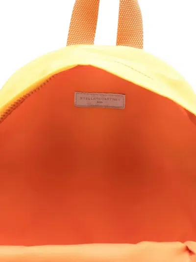 Stella Mccartney Face-detail Backpack In Orange