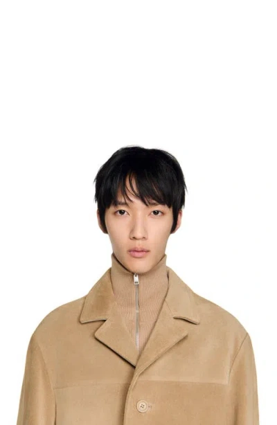 Sandro Long Belted Leather Coat In Brown