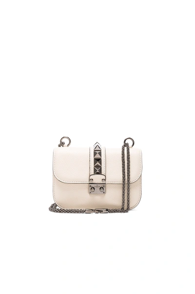 Valentino Garavani Small Lock Shoulder Bag In White. In Light Ivory