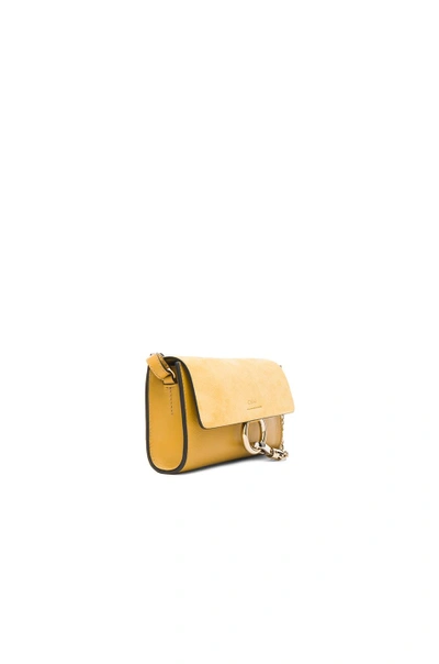 Shop Chloé Faye Strap Wallet In Dusty Yellow