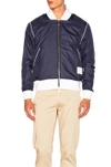 THOM BROWNE DOUBLE SIDED BOMBER JACKET IN BLUE.,MJT050A-01435