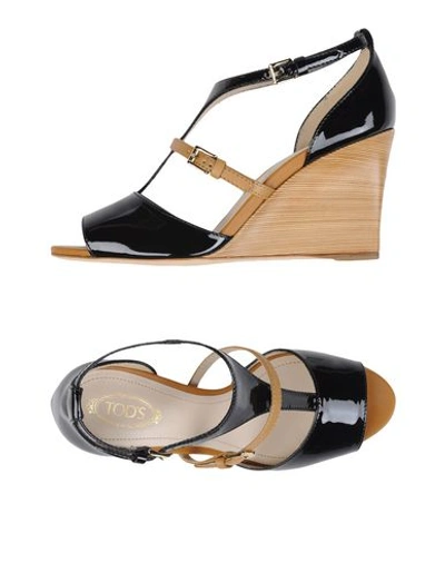 Shop Tod's Sandals In Black