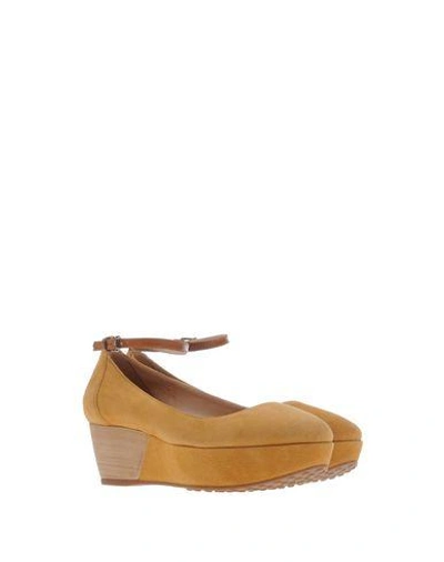 Shop Tod's Pump In Camel