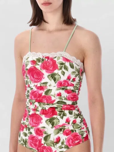Chloé Bow-detailed Ruched Lace-trimmed Floral-print Swimsuit In Multi