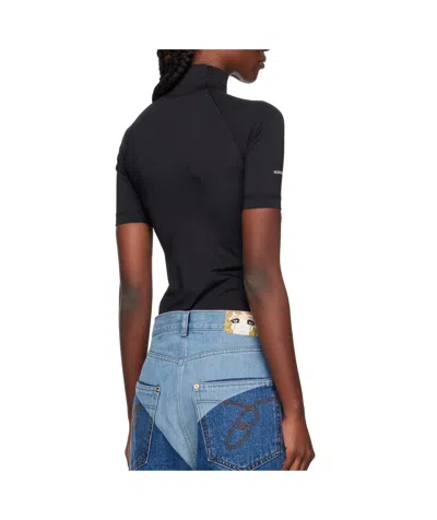 Pushbutton Security Pocket Turtleneck Top In Black