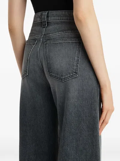 Khaite Dane Mid-rise Stretch Denim Wide-leg Jeans In Gray
