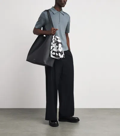 Sandro Knitted Polo Shirt With Zip Collar In Blue