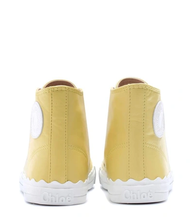 Shop Chloé High-top Leather Sneakers In Yellow Suelight