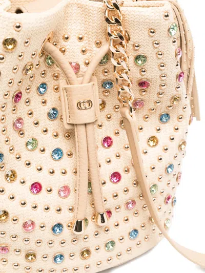 La Carrie Crystal-embellished Studded Bucket Bag In Neutral