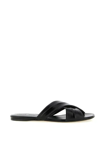 Khaite Liria Glossed-leather Sandals In Black