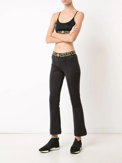 Shop Versace Greek Key Waistband Flared Leggings In Black