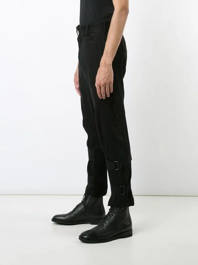 Shop Ann Demeulemeester Ankle Strap Trousers - Black