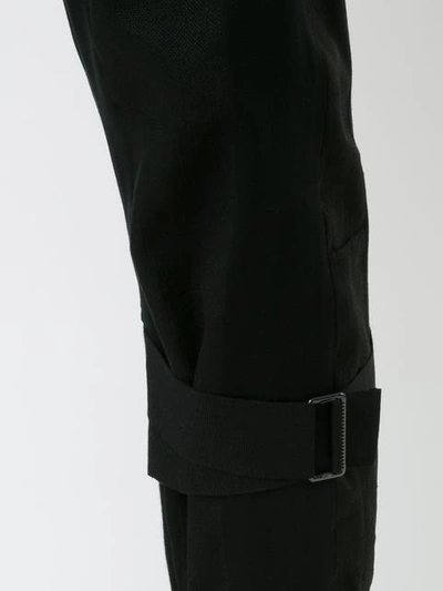 Shop Ann Demeulemeester Ankle Strap Trousers - Black