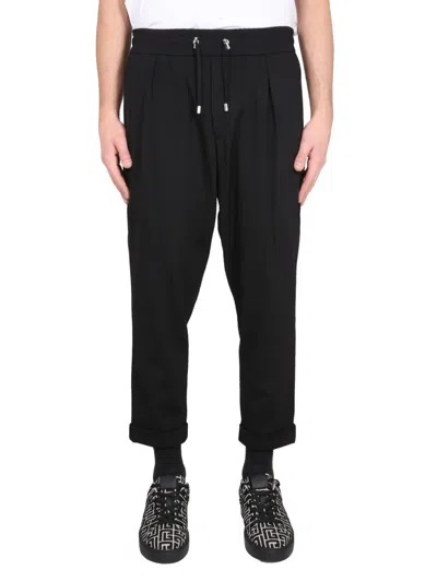 Balmain Timeless Embossed-button Drawstring-waist Trousers.