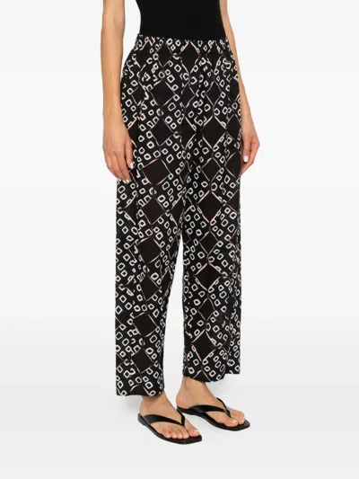 Yavi Geometric-pattern Trousers In Black