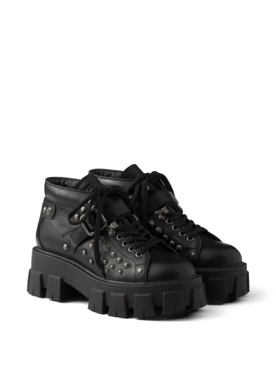 Prada Monolith Studded Leather Booties In Black