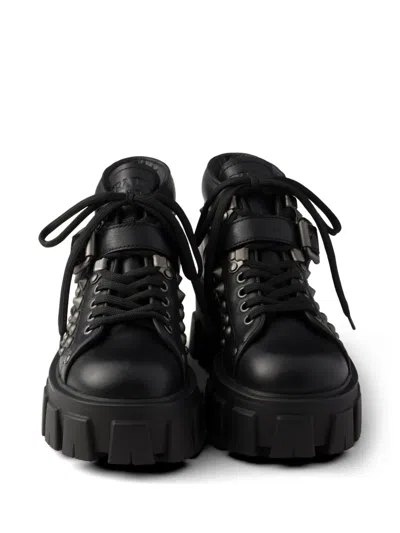 Prada Monolith Studded Leather Booties In Black