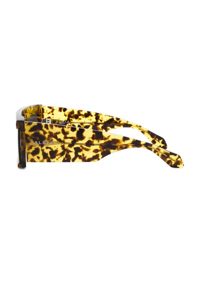 Alaïa Cut Rectangular Sunglasses In Brown