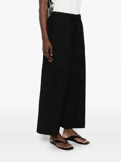 Totême Drawstring Patch-pocket Trousers In Black