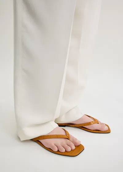 Totême Toteme Crocodile-effect Leather Flip Flops In Orange