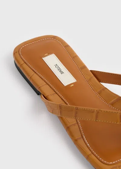 Totême Toteme Crocodile-effect Leather Flip Flops In Orange