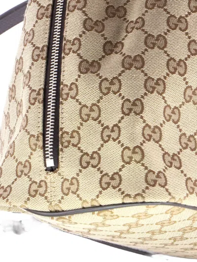Pre-owned Gucci Drawstring Gg Canvas Medium Backpack In Brown