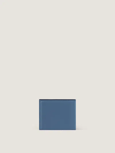 Givenchy Embossed Logo Flap Wallet In Blue